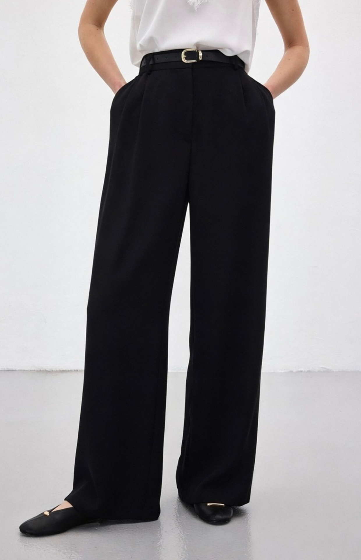 Detail shot of black tailored trousers fabric and stitching Kochila Couture