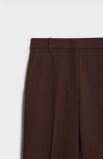 Detail shot of dark brown tailored trousers fabric and stitching Kochila Couture